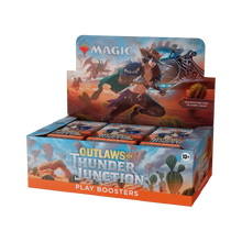 Display box of 'Outlaws of Thunder Junction' play boosters for Magic: The Gathering on a white background.