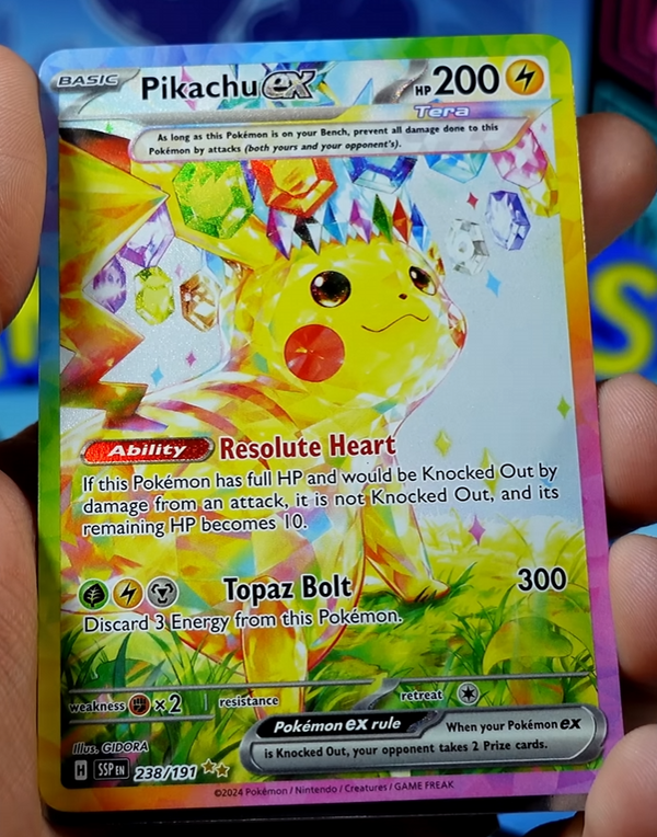 Hand holding a Pikachu ex special illustration rare card
